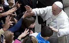 Pope Francis greets faithful as he arrives for a meeting with relatives of innocent mafia victims, in Rome's St. Gregorio VII church, just outside the Vatican, Friday, March 21, 2014. (photo credit: AP Photo/Andrew Medichini)