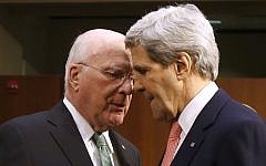Secretary of State John Kerry, right, talks with Sen. Patrick Leahy on Capitol Hill in Washington, March 13, 2014. (photo credit: AP/Charles Dharapak)