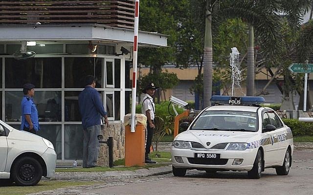 A police car comes out of a main gate of the missing Malaysia Airlines pilot Zaharie Ahmad Shah's house in Shah Alam, outside Kuala Lumpur, Malaysia, on Saturday, March 15, 2014. (photo credit: AP Photo) A police car comes out of a main gate of the missing Malaysia Airlines pilot Zaharie Ahmad Shah's house in Shah Alam, outside Kuala Lumpur, Malaysia, on Saturday, March 15, 2014. (photo credit: AP Photo)