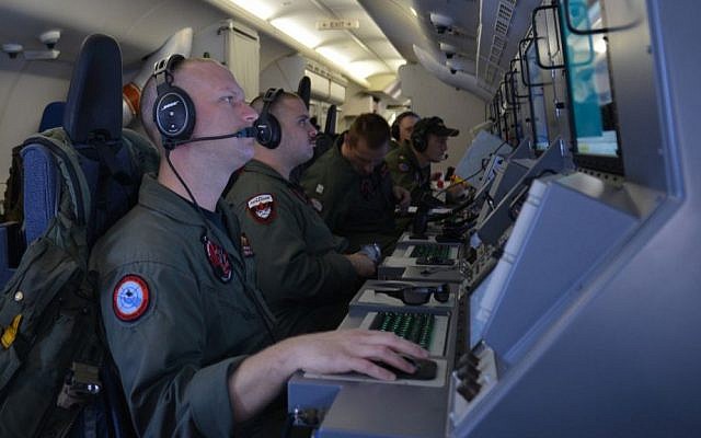 In this photo provided by the US Navy, crew members on board an aircraft P-8A Poseidon assist in search and rescue operations for Malaysia Airlines flight MH370 in the Indian Ocean on Sunday, March 16. (AP Photo/US Navy, Eric A. Pastor) In this photo provided by the US Navy, crew members on board an aircraft P-8A Poseidon assist in search and rescue operations for Malaysia Airlines flight MH370 in the Indian Ocean on Sunday, March 16. (AP Photo/US Navy, Eric A. Pastor)