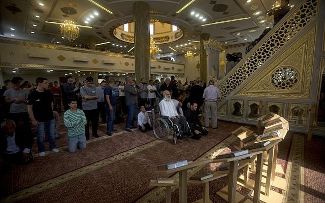People pray in a new mosque, partially funded by Chechnya, in the Arab village of Abu Ghosh, on the outskirts of Jerusalem, Sunday, March 23, 2014. (photo credit: AP/Sebastian Scheiner)