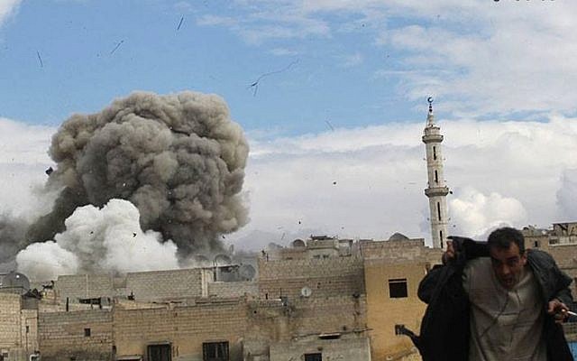 This photo provided by the anti-government activist group Aleppo Media Center (AMC), which has been authenticated based on its contents and other AP reporting, shows a Syrian man, right, runs for cover from a Syrian government forces airstrike attack, in Aleppo, Syria, Tuesday, Feb. 27, 2014. (AP Photo/Aleppo Media Center, AMC) This photo provided by the anti-government activist group Aleppo Media Center (AMC), which has been authenticated based on its contents and other AP reporting, shows a Syrian man, right, runs for cover from a Syrian government forces airstrike attack, in Aleppo, Syria, Tuesday, Feb. 27, 2014. (AP Photo/Aleppo Media Center, AMC)
