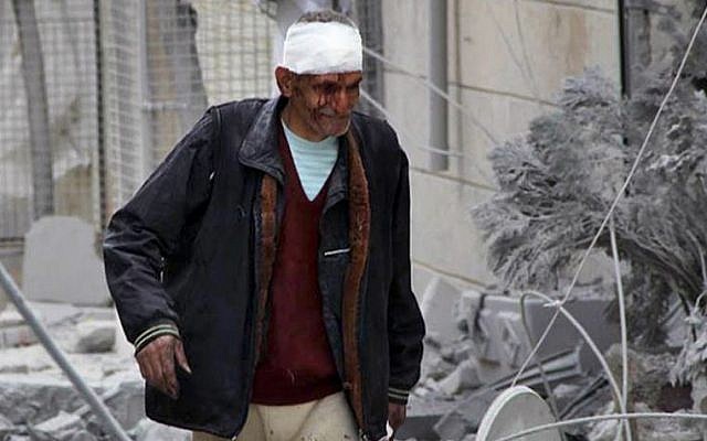 The aftermath of an airstrike in Aleppo, Syria, on Tuesday, March 18, 2014. (photo credit: AP Photo/Aleppo Media Center, AMC) The aftermath of an airstrike in Aleppo, Syria, on Tuesday, March 18, 2014. (photo credit: AP Photo/Aleppo Media Center, AMC)