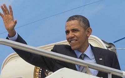 US President Barack Obama waves as he boards Air Force One at Fiumicino Airport in Rome, Italy, on Friday, March 28, 2014 (photo credit: AP/Pablo Martinez Monsivais)