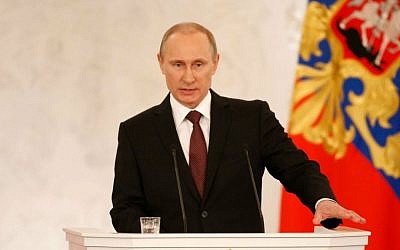 Russian President Vladimir Putin addresses the Federation Council in Moscow's Kremlin on Tuesday, March 18, 2014. (photo credit: AP/Alexander Zemlianichenko) Russian President Vladimir Putin addresses the Federation Council in Moscow's Kremlin on Tuesday, March 18, 2014. (photo credit: AP/Alexander Zemlianichenko)