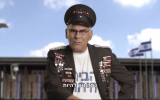 Labor MK Moshe Mizrahi dressed in a Sgt. Pepper-esque outfit in a Peace Now video (screen capture: YouTube)