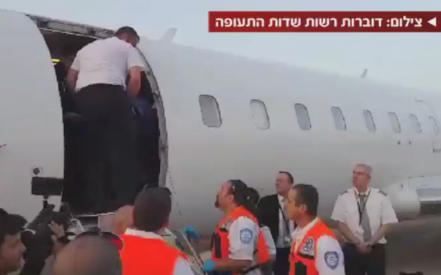 Emergency medical personnel at Tel Aviv's Ben Gurion Airport prepare to receive the wounded from Kiev on Friday (photo credit: screenshot via Channel 2) Emergency medical personnel at Tel Aviv's Ben Gurion Airport prepare to receive the wounded from Kiev on Friday (photo credit: screenshot via Channel 2)