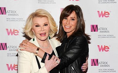Joan Rivers (left), and daughter Melissa Rivers at the 2013 Matrix New York Women in Communications Awards, in New York, April 22, 2013. (AP/Evan Agostini/Invision)
