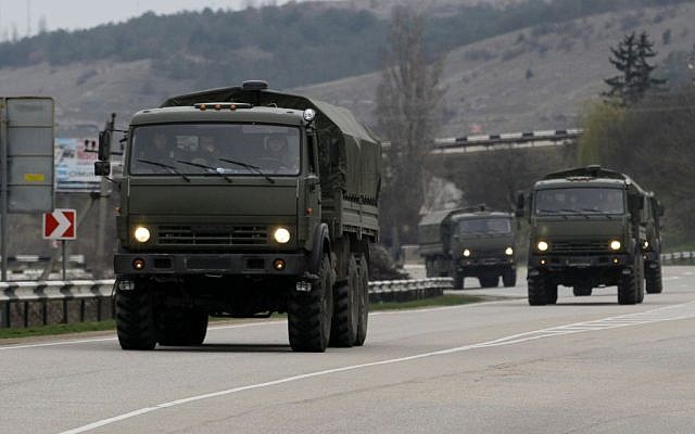 Russian military vehicles heading to the Crimean capital of Simferopol, Sunday, March 2, 2014. (Photo: AP/Darko Vojinovic) Russian military vehicles heading to the Crimean capital of Simferopol, Sunday, March 2, 2014. (Photo: AP/Darko Vojinovic)