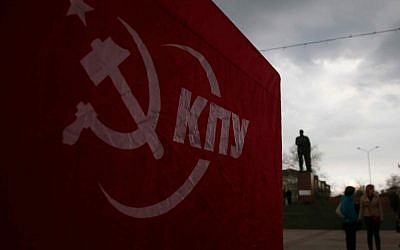 A tent with the symbol and the name of the Ukrainian Communist party are seen as people discuss the situation at a central square in Simferopol, Ukraine, on Wednesday, March 5, 2014. (photo credit: AP/Sergei Grits)