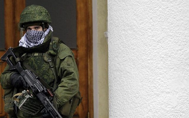 An unidentified soldier patrols in front of the airport in the city of Simferopol in Crimea, Ukraine, February 28, 2014. (AP/Darko Vojinovic) An unidentified soldier patrols in front of the airport in the city of Simferopol in Crimea, Ukraine, February 28, 2014. (AP/Darko Vojinovic)