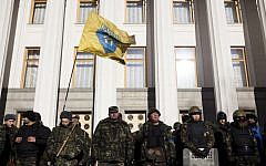 Self defense volunteers line up outside the Parliament in Kiev, Ukraine, Monday, March 17, 2014. (photo credit: AP Photo/David Azia)