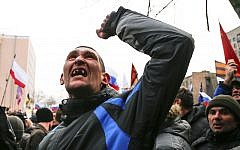 A pro-Russia demonstrator gestures in Ukraine on Sunday, March 16, 2014. (photo credit: AP Photo/Andrey Basevich)