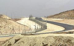 Illustrative: A section of the security fence near Hebron (Wikipedia)