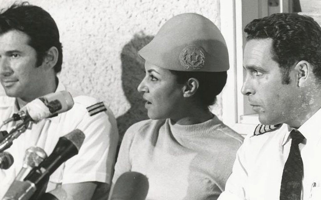 Uri Bar-Lev (right), flight attendant Janet Darmijan and senior flight attendant Abraham Eizenov speak to the media on their safe return to Israel, September 1970 (photo credit: Courtesy El Al archive) Uri Bar-Lev (right), flight attendant Janet Darmijan and senior flight attendant Abraham Eizenov speak to the media on their safe return to Israel, September 1970 (photo credit: Courtesy El Al archive)