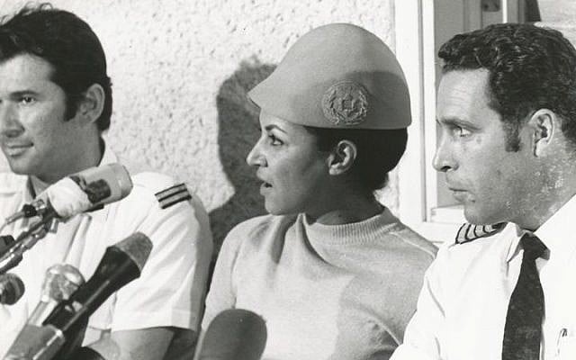Uri Bar-Lev (right), flight attendant Janet Darmijan and senior flight attendant Abraham Eizenov speak to the media on their safe return to Israel, September 1970 (photo credit: Courtesy El Al archive)