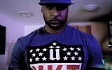 French rapper Booba, here in the music video for his song Parlons Peu. (screen capture, YouTube)