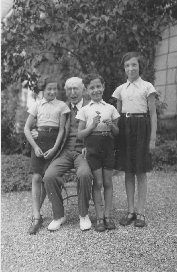 Alfred poses cheerfully with his son Pierre’s children: Françoise, Nicole, and Charles - Alfred’s only living grandchild. (Photo credit: Dreyfus family collection) Alfred poses cheerfully with his son Pierre’s children: Françoise, Nicole, and Charles - Alfred’s only living grandchild. (Photo credit: Dreyfus family collection)