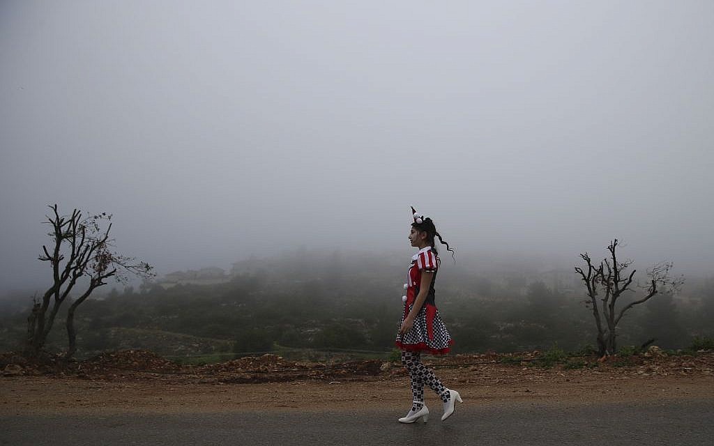 Walking through a foggy morning in costume (photo credit: Nati Shohat/Flash 90) Walking through a foggy morning in costume (photo credit: Nati Shohat/Flash 90)
