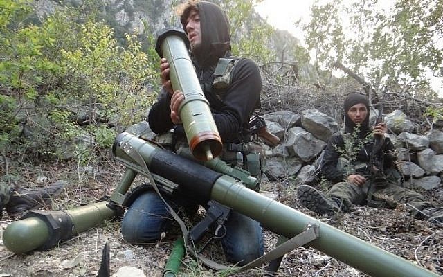 A rebel fighter checks a launcher near the village of Kasab and the border crossing with Turkey, in the northwestern province of Latakia, on March 24, 2014. (file photo credit: AFP PHOTO/AMR RADWAN AL-HOMSI) A rebel fighter checks a launcher near the village of Kasab and the border crossing with Turkey, in the northwestern province of Latakia, on March 24, 2014. (file photo credit: AFP PHOTO/AMR RADWAN AL-HOMSI)