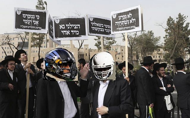 Ultra-Orthodox men protesting the NFL draft in Jerusalem on Sunday. (photo illustration: Nati Shohat/FLASH90) Ultra-Orthodox men protesting the NFL draft in Jerusalem on Sunday. (photo illustration: Nati Shohat/FLASH90)