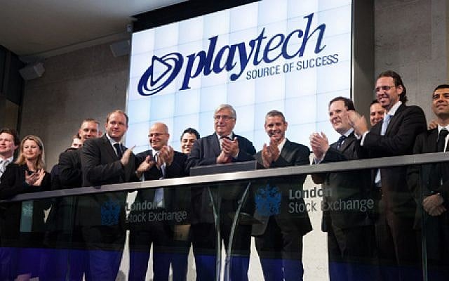 Officials from Playtech and the London Stock Exchange celebrate Playtech's listing on the Exchange's Main Market in July 2012 (Courtesy) Officials from Playtech and the London Stock Exchange celebrate Playtech's listing on the Exchange's Main Market in July 2012 (Courtesy)