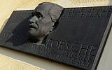 A memorial plaque displays a sculpture featuring Ferdinand Porsche, German automotive engineer and founder of the Porsche car company, on his family house in his native village of Vratislavice near Liberec on February 27, 2014. (photo credit: AFP Photo/Michal Cizek)