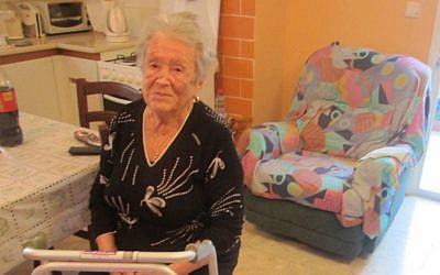 Israeli nonagenarian Mina Yuditskaya Berliner in a Tel Aviv apartment said to have been purchased by her former student, Vladimir Putin. (JTA/Ben Sales)