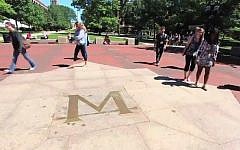 Students on the University of Michigan campus (screen capture: YouTube)