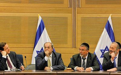 MK Aryeh Deri (R), MK Ahmad Tibi (2L), Labor Party head MK Isaac Herzog (L) and MK Yitzhak Vaknin at a meeting of the opposition at the Knesset, March 11, 2014 (photo credit: Miriam Alster/Flash90)