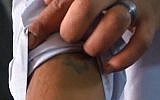 Shenouda Ashraf Sobhy Zekry shows off his Star of David tattoo (screen capture:YouTube)