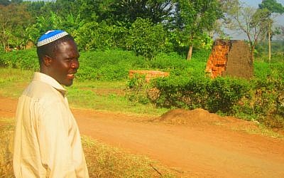 Enosh Keki Maniah, the head of the breakaway Orthodox faction of Uganda’s Abayudaya Jewish community, says, 'We didn’t  have a grudge with anyone.' (photo credit: JTA/Ben Sales)