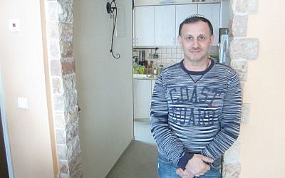 Yuriy Yukhatskov has been trying to immigrate to Israel for three years, but has been denied due to what he says is an error he made filling out a form. (photo credit: Ben Sales/JTA)