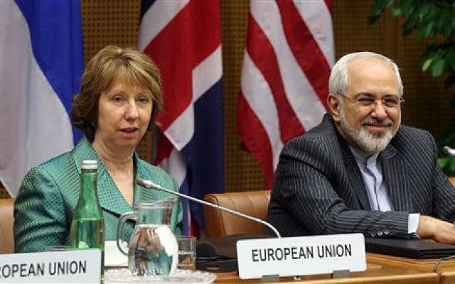 European Union foreign policy chief Catherine Ashton, left, and Iranian Foreign Minister Mohamad Javad Zarif, right, wait for the start of closed-door nuclear talks in Vienna, Tuesday, March 18, 2014 (photo credit: AP/Ronald Zak) European Union foreign policy chief Catherine Ashton, left, and Iranian Foreign Minister Mohamad Javad Zarif, right, wait for the start of closed-door nuclear talks in Vienna, Tuesday, March 18, 2014 (photo credit: AP/Ronald Zak)