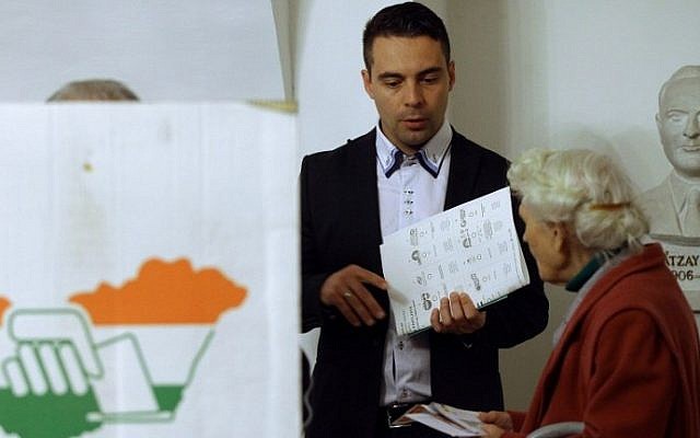 Hungarian far-right Jobbik party leader Gabor Vona waits to cast his ballot at a local polling station in Gyongyos, Hungary, Sunday, April 6, 2014. (photo credit: Attila Kisbenedek/AFP) Hungarian far-right Jobbik party leader Gabor Vona waits to cast his ballot at a local polling station in Gyongyos, Hungary, Sunday, April 6, 2014. (photo credit: Attila Kisbenedek/AFP)