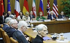 (Background, LtoR) EU Deputy Secretary General Helga Schmid, Vice President of the European Commission Catherine Margaret Ashton, Iranian Foreign Minister Javad Mohammad Zarif, and Iranian ambassador to Austria Hassan Tajik attend the so-called EU 5+1 Talks with Iran at the UN headquarters in Vienna, on April 8, 2014. (AFP/Dieter Nagl/file)