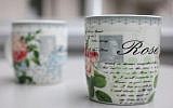 Two coffee mugs featuring a picture of a stamp with Adolf Hitler's portrait on it can be seen in Herford, western Germany on April 11, 2014. (photo credit: AFP PHOTO / DPA / OLIVER KRATO0)