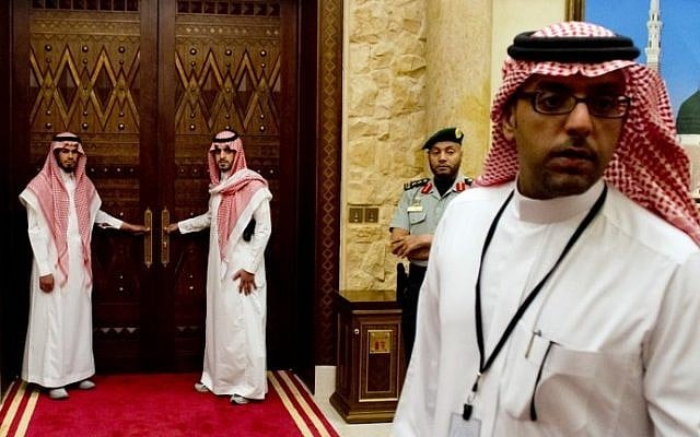 Aides to Saudi King Abdullah stand outside a room in the monarch's desert camp about 60 kilometers northeast of Riyadh while he meets with US President Barack Obama, March 2014. (photo credit: Saul Loeb/AFP) Aides to Saudi King Abdullah stand outside a room in the monarch's desert camp about 60 kilometers northeast of Riyadh while he meets with US President Barack Obama, March 2014. (photo credit: Saul Loeb/AFP)