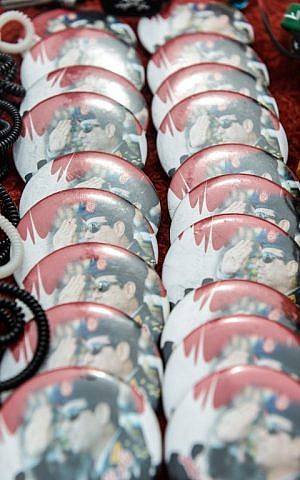 Pins bearing portraits of retired army chief and presidential candidate Abdel Fattah al-Sissi are displayed for sale at a shop on April 13, 2014 in the Egyptian capital Cairo. (photo credit: AFP Photo/Mohamed el-Shahed) Pins bearing portraits of retired army chief and presidential candidate Abdel Fattah al-Sissi are displayed for sale at a shop on April 13, 2014 in the Egyptian capital Cairo. (photo credit: AFP Photo/Mohamed el-Shahed)