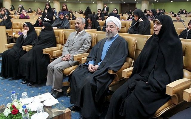 A handout picture released on April 20, 2014 by the official website of the Iranian president show Iranian President Hassan Rowhani (2ndR) listening during a forum attended by members of Iran's female elite to mark Women's Day in Iran. (photo credit: AFP Photo/HO/Iranian Presidency) A handout picture released on April 20, 2014 by the official website of the Iranian president show Iranian President Hassan Rowhani (2ndR) listening during a forum attended by members of Iran's female elite to mark Women's Day in Iran. (photo credit: AFP Photo/HO/Iranian Presidency)