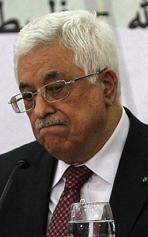 Palestinian Authority President Mahmoud Abbas gestures as he gives a speech during a meeting with the Palestine Liberation Organization's Central Council in the West Bank city of Ramallah, on April 26, 2014. (photo credit: AFP/Abbas Momani)