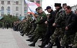 Russian soldiers and pro-Russian volunteers during a military parade rehearsal in preparation for the Victory Day parade in Simferopol, Crimea, on April 12, 2014. (photo credit: AFP/Yuri Lashov)