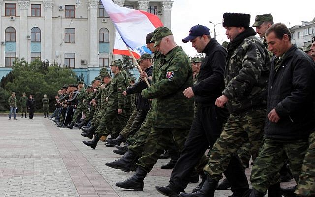Russian soldiers and pro-Russian volunteers during a military parade rehearsal in preparation for the Victory Day parade in Simferopol, Crimea, on April 12, 2014. (photo credit: AFP/Yuri Lashov) Russian soldiers and pro-Russian volunteers during a military parade rehearsal in preparation for the Victory Day parade in Simferopol, Crimea, on April 12, 2014. (photo credit: AFP/Yuri Lashov)