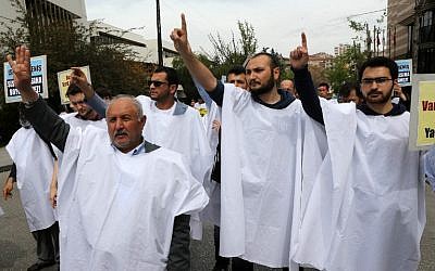 Supporters of the Egyptian Muslim Brotherhood stage a rally to protest against the death penalties for the members of the radical group in Egypt, in Ankara on April 25, 2014. (photo credit: AFP/ADEM ALTAN)