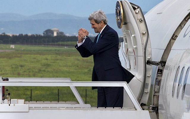 US Secretary of State John Kerry gestures while leaving Algeria en route to Rabat, Morocco on April 3, 2014.(photo credit: AFP/POOL/Jacquelyn Martin) US Secretary of State John Kerry gestures while leaving Algeria en route to Rabat, Morocco on April 3, 2014.(photo credit: AFP/POOL/Jacquelyn Martin)