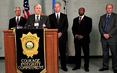 Overland Park Police Chief John Douglass addresses the media alongside US Attorney for the District of Kansas Barry Grissom, FBI Special Agent in Charge Michael Kaste, and Johnson County District Attorney Steve Howe during a press conference after a gunman killed three people at Jewish centers in Kansas on April 14, 2014. (photo credit: Jamie Squire/Getty Images/AFP)