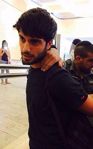 A student is arrested at the Hebrew University of Jerusalem for rallying against the Christian Arab draft (photo credit: Hala Marsood) A student is arrested at the Hebrew University of Jerusalem for rallying against the Christian Arab draft (photo credit: Hala Marsood)
