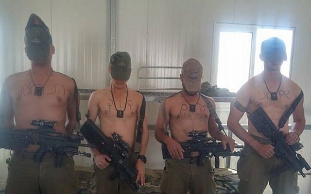 Soldiers hold signs supporting "David from the Nahal Brigade" (Photo credit: Facebook photo) Soldiers hold signs supporting "David from the Nahal Brigade" (Photo credit: Facebook photo)