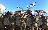 Soldiers hold signs supporting 'David from the Nahal Brigade' (Photo credit: Facebook photo)
