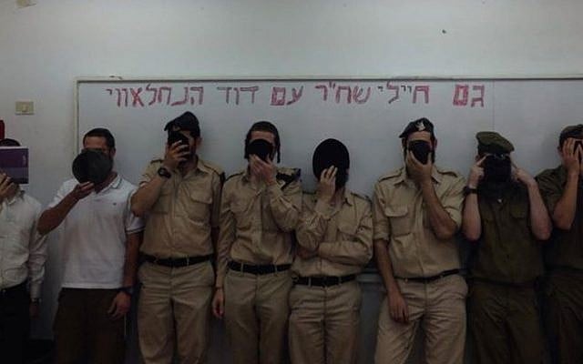Soldiers hold signs supporting "David from the Nahal Brigade" (Photo credit: Facebook photo) Soldiers hold signs supporting "David from the Nahal Brigade" (Photo credit: Facebook photo)